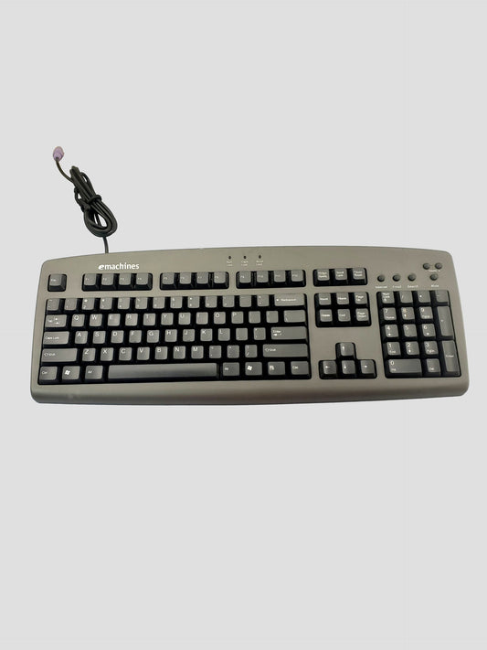 Emachines: Model #5143 wired Computer Keyboard with attached purple PS/2 plug